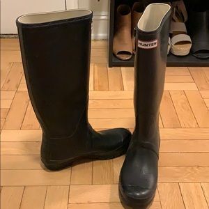 Tall black hunter boots